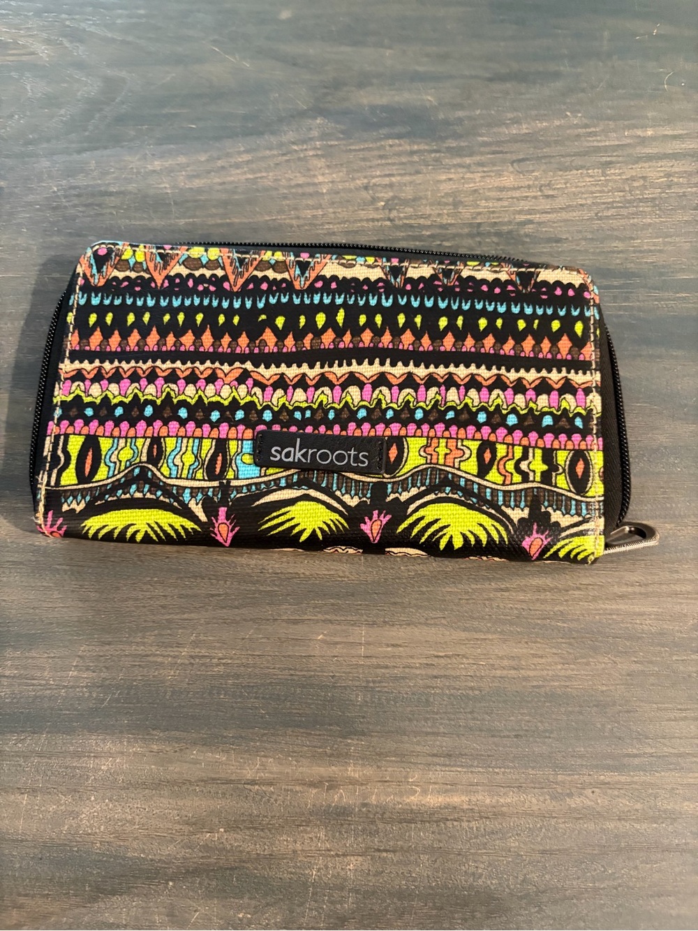 Sakroots Black Zip Wallet with Neon Tribal Print.